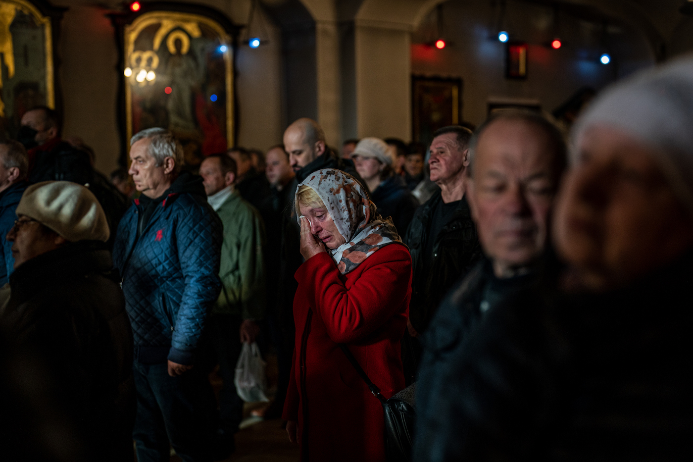A woman cries in the church service on Easter Sunday in Bucha, Ukraine on April 24, 2022. Wolfgang Schwan - Anadolu Agency