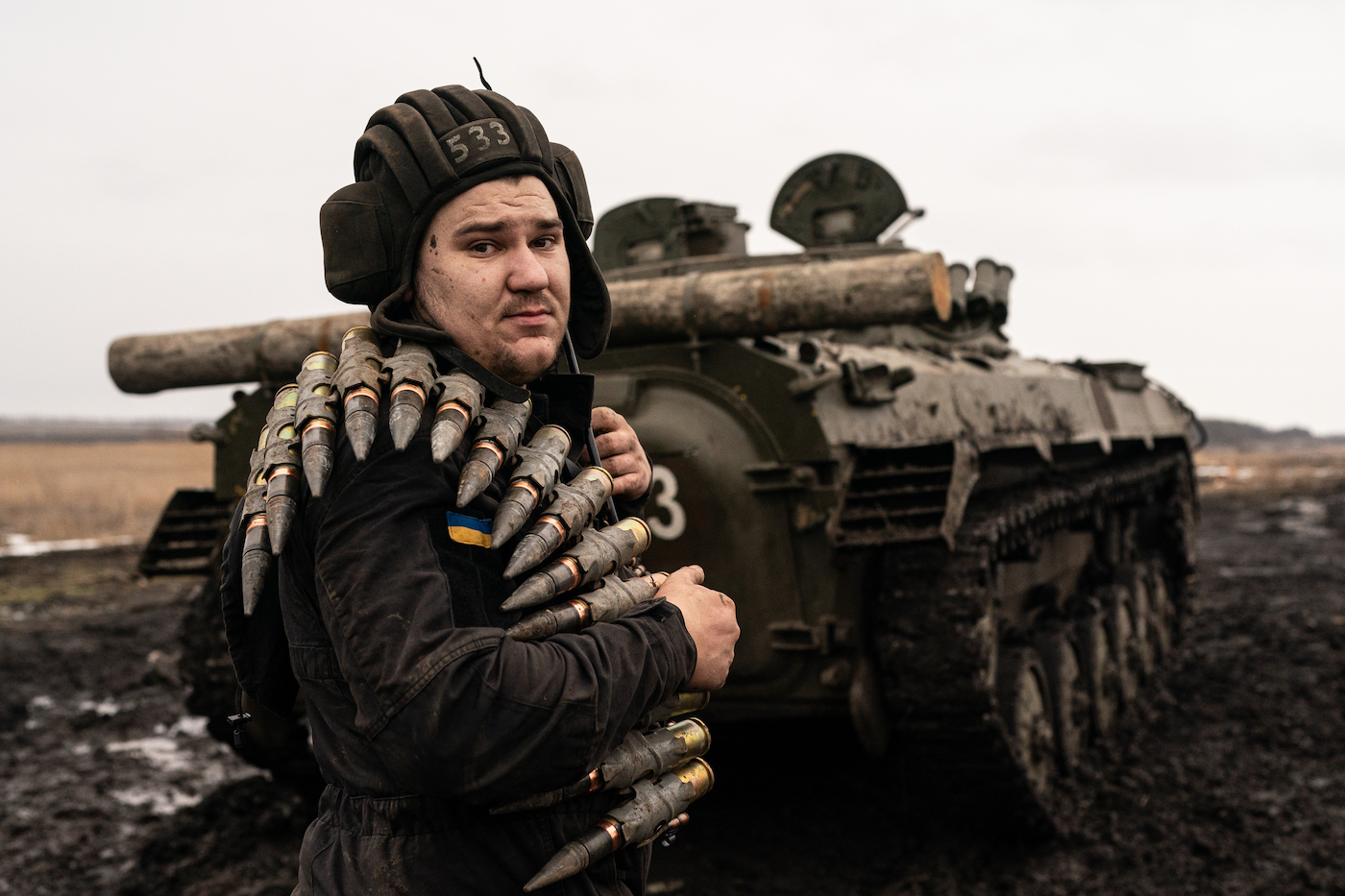 A Ukrainian serviceman with the 30th Mechanized Brigade is seen carrying 30mm ammunition while training with a BMP-2 in Donetsk Region, Ukraine on February 10, 2022. Wolfgang Schwan - Anadolu Agency